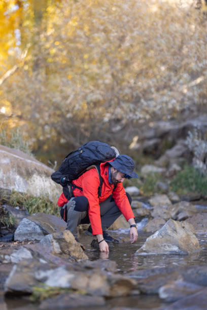 istock Man traveling relaxing alone with river canyon view. 1483018736