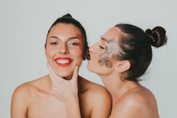 istock Two beautiful young women with face make-up art 1483020004