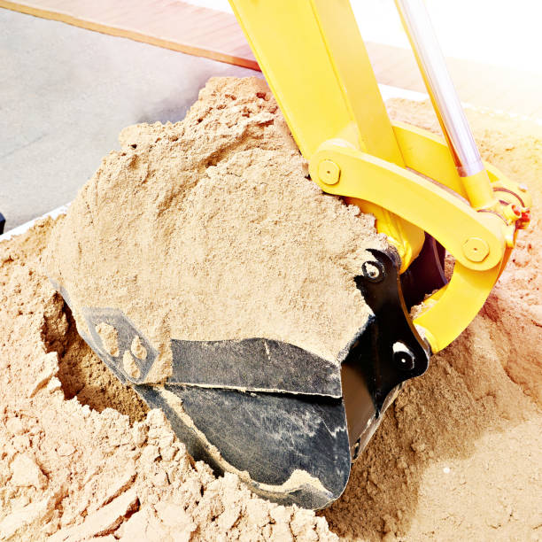 istock Bucket of excavator with sand 1483020139