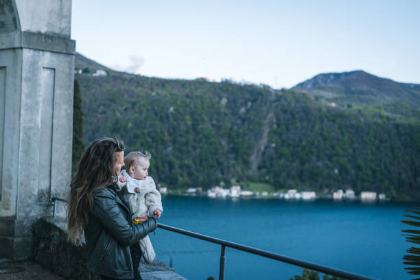 istock Mother and infant look over lake from observation point 1483020639