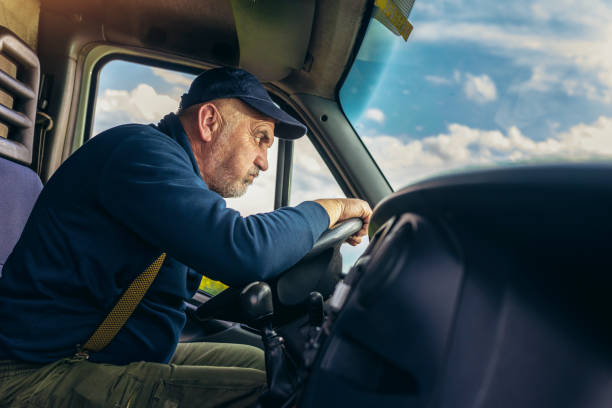 istock Professional driver driving a truck on the road. 1483021880