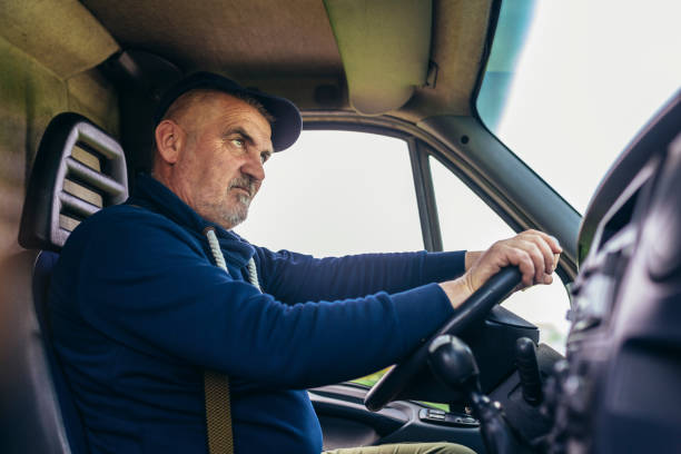 istock Professional driver driving a truck on the road. 1483021946