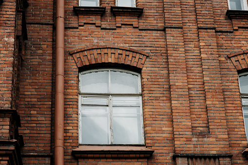 window of old brick building. abandoned brick wall of factory