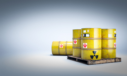 3d render yellow radioactive barrels on pallets