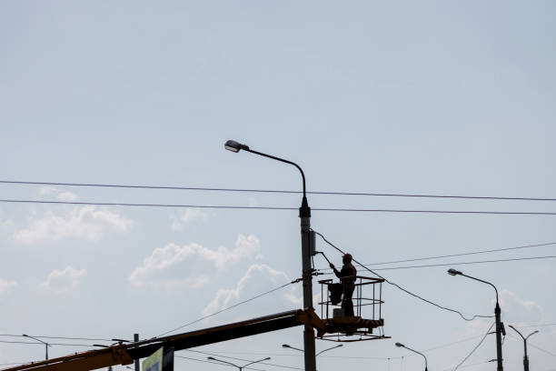 istock silhouette of a worker painting a lamppost 1483022155