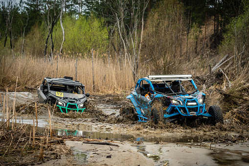 Atv vehicles in muddy water at the quad (buggy) competition