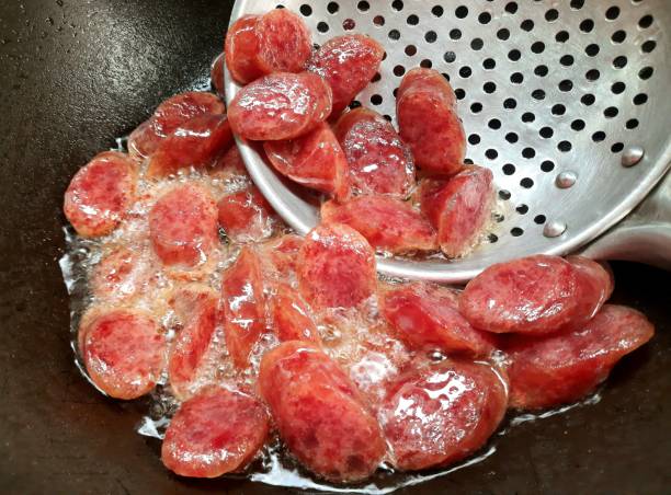 istock Cooking Chinese Pork Sausage - food preparation. 1483030745