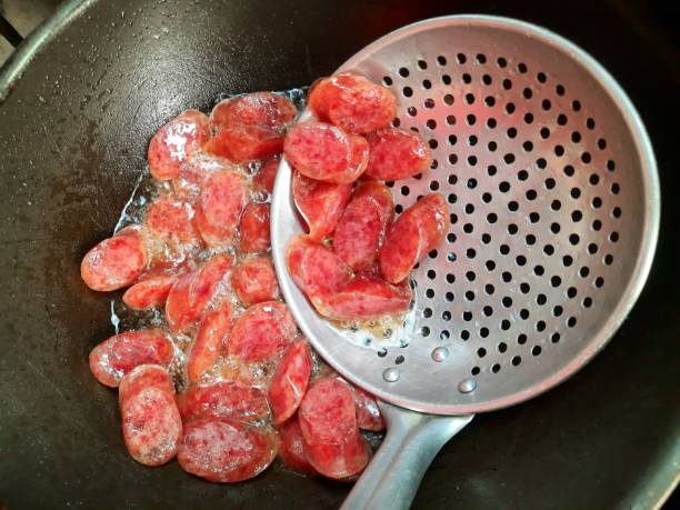 istock Cooking Chinese Pork Sausage - food preparation. 1483030749