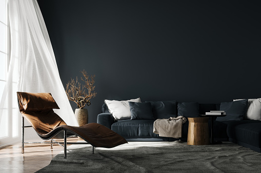 Modern interior design of living room. Black sofa and empty mockup wall background.
