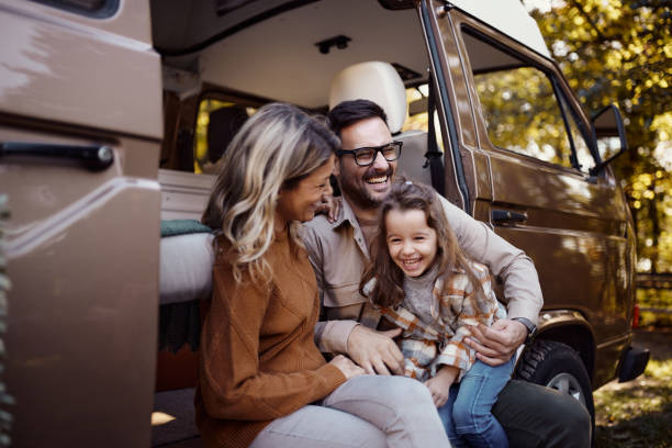 istock Cheerful family having fun during autumn day at trailer park. 1483033116