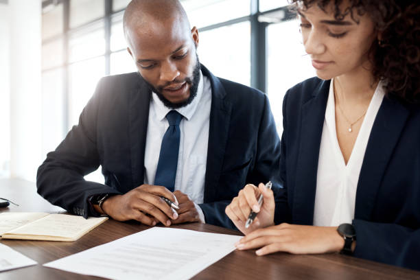 istock Documents, business team and black people reading notes for accounting strategy, planning and company portfolio review. Meeting, analysis and executive office contract of legal corporate consulting 1483033820