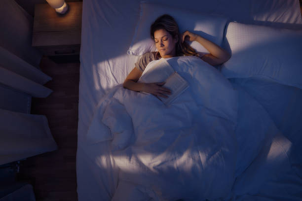 istock Above view of young woman sleeping in bed. 1483033945