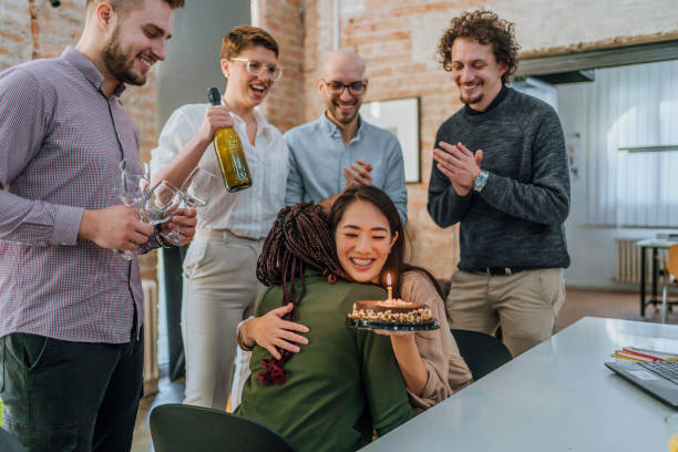 istock Colleagues celebrating a female colleague's birthday 1483034196