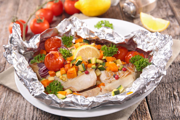istock baked fish in oil with vegetables 1483035701