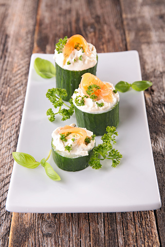 cucumber with cream cheese and smoked salmon- finger food, snack,catering food