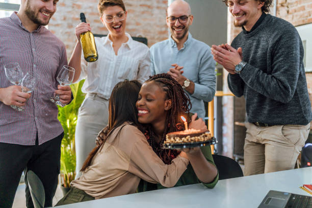 istock Colleagues celebrating a female colleague's birthday 1483036899