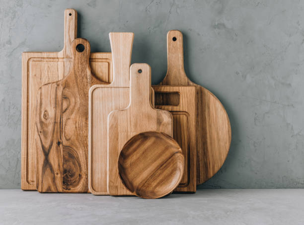 istock Kitchen utensils background with set of wooden cutting boards 1483038235