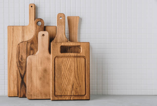 istock Kitchen utensils background with set of wooden cutting boards 1483038246