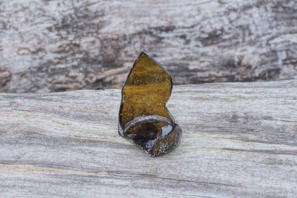 istock one sharp brown piece of a broken glass bottle 1483038774