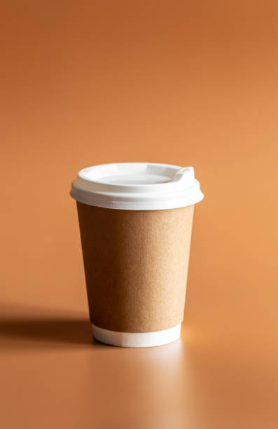 istock Eco-Friendly Craft Disposable Brown Cup on brown background Isolated. 1483039671