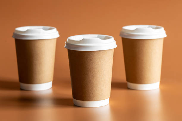 istock Eco-Friendly Craft Disposable Brown Cup on brown background Isolated. 1483039677
