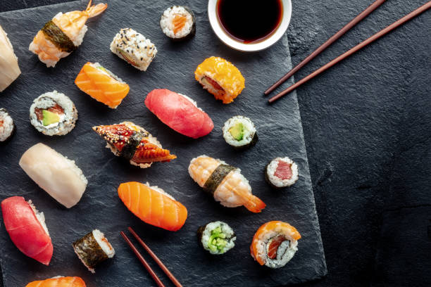 istock Sushi overhead flat lay shot with chopsticks, soy sauce, and copy space 1483040000