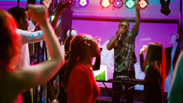istock DJ wearing headset on stage at party 1483040294