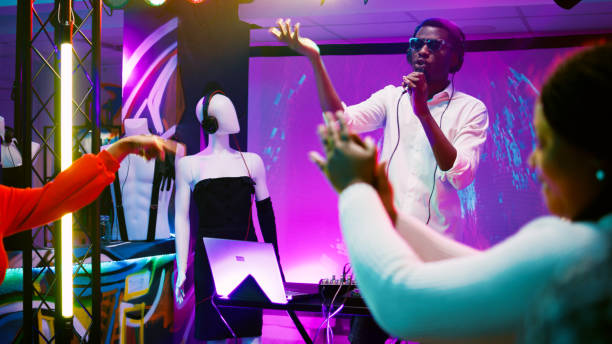 istock DJ partying on stage with audio station 1483040316