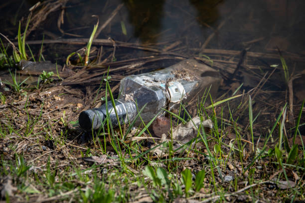 istock A glass bottle floats in water. Trash thrown into the ditch 1483041513