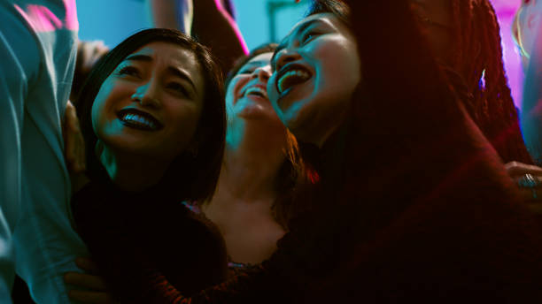 istock Diverse group of friends taking photos 1483041592