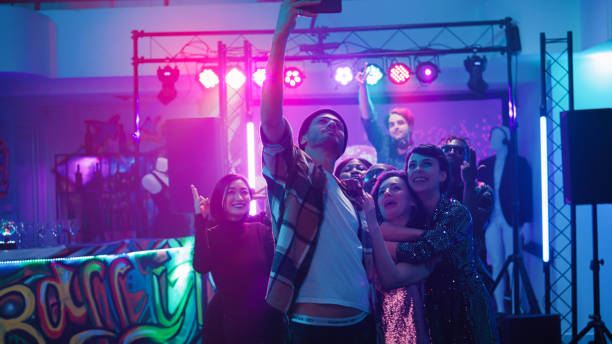 istock Diverse group of adults taking photos 1483041655