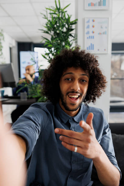 istock Entrepreneur recording video presentation on mobile phone front camera 1483043715