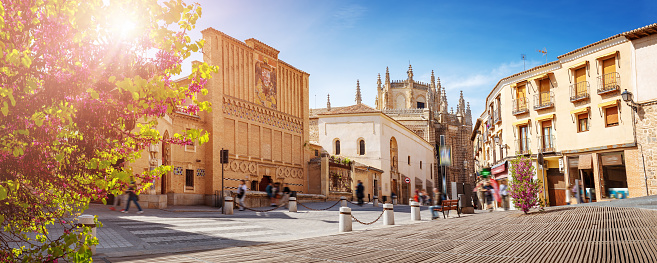 Panoramic view in Toledo, Spain with antique buildings of Sofer Square, School of Art and Monastery of San Juan de los Reyes. Concept of the famous places and tourism.