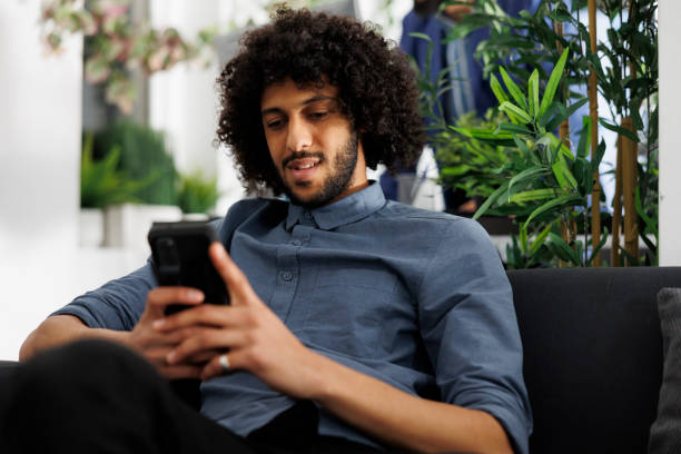 istock Company project manager writing message to coworkers using smartphone 1483044428