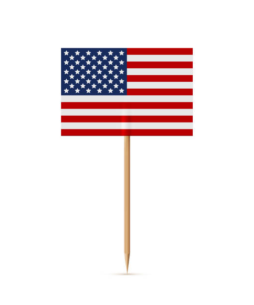 istock Miniature rectangle paper American flag on wooden stick or toothpick. Decoration for cupcake or other food. 4th of July, Independence or Presidents Day of USA, United States of America 1483048383