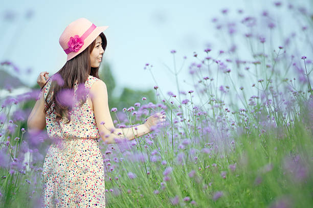 A Chinese young women playing in the vast lavender