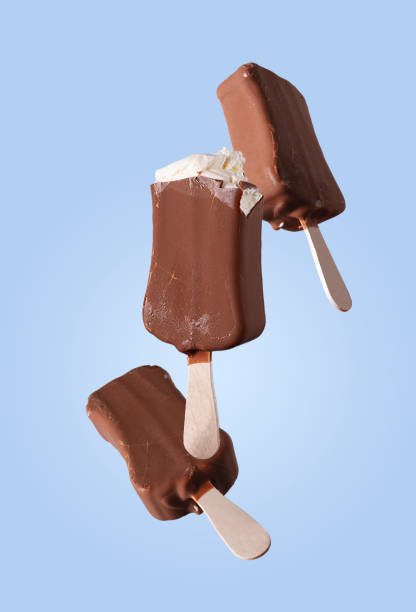 istock popsicle in chocolate icing on a blue background, flying food 1483049027