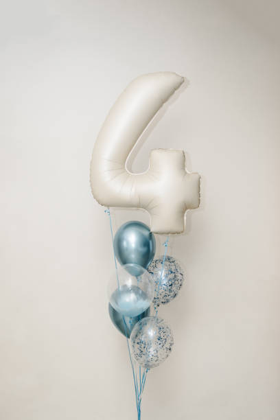 istock Gel white, blue air balloons decorated for a boy isolated on white background. Copy space. Details arch for 4 year and photo wall. Reception at a birthday party. Idea for party. Four year old children 1483051262