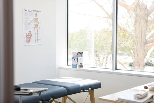 Empty medical examination room prepared for the next patient This is a photo of an empty medical examination room that has been cleaned and prepared for the next patient at the doctor's office. medical examination room stock pictures, royalty-free photos & images