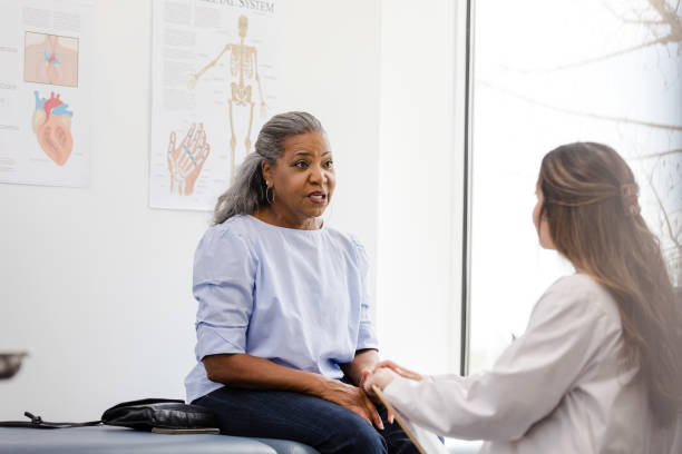 istock Mature woman talks with her female doctor about concerns she has 1483051992