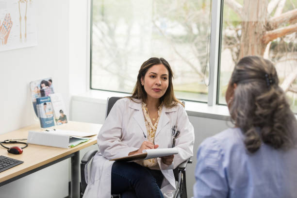 istock Specialist pauses while making notes in the patient's medical chart 1483051998