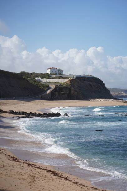 istock View past beach to hilltop town 1483053931