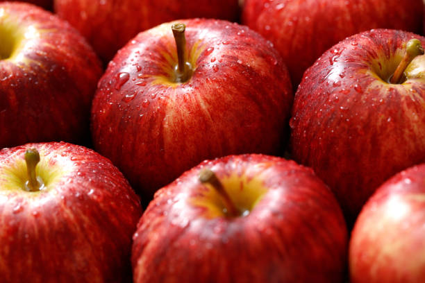 istock fresh red apple texture background in the supermarket 1483055831