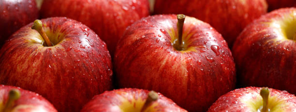 istock fresh red apple texture background in the supermarket 1483056356