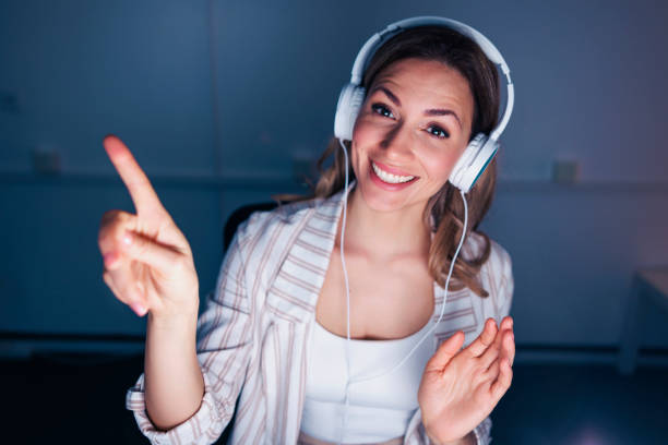 istock Woman having online meeting while working late 1483056427