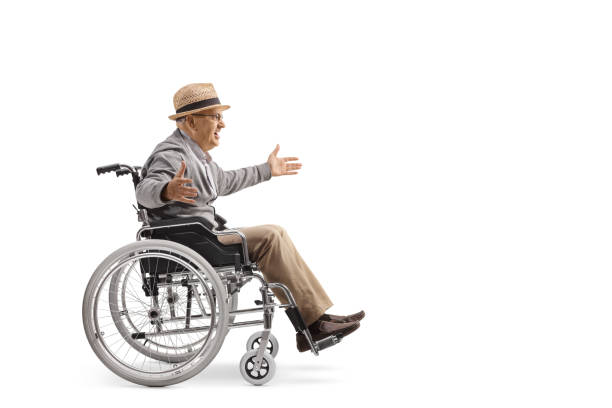 elderly man in a wheelchair smiling and spreading arms - physical injury men orthopedic equipment isolated on white imagens e fotografias de stock