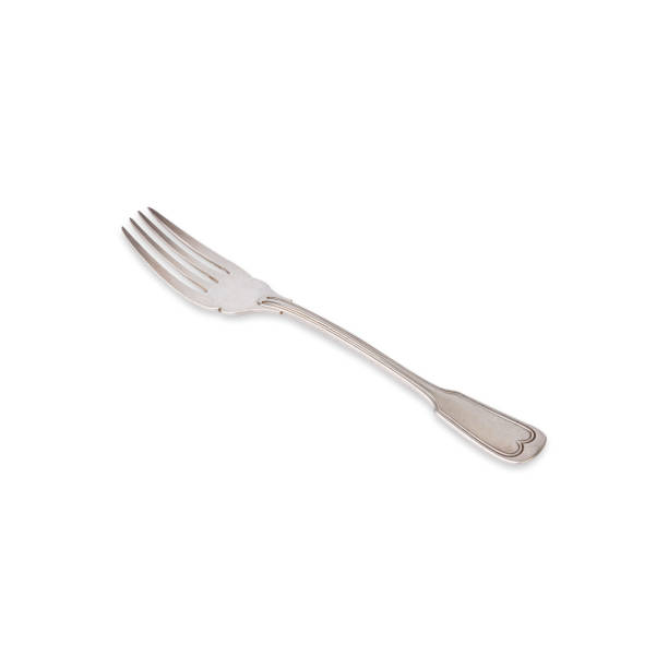 istock Old vintage metal fork isolated over white background 1483057246