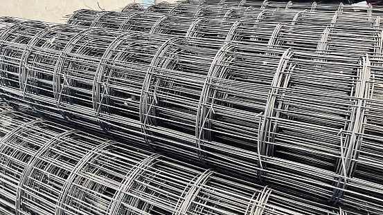 Production of reinforcement baskets on a machine for welding piles. longitudinal steel rods of the foundations of buildings, bridges, roads. They are inserted into the borehole underground. the concre, drilling, structural engineering, tubular, rod, workspace