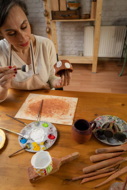 istock Woman painting a pottery 1483060725