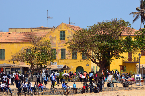 Gorée Island, Dakar, Senegal: people enjoying a tranquil Saturday - French colonial architecture and baobab tree, Human Rights Square ('Esplanade des Droits de l'Homme').